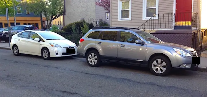 The car of personal finance blogger 'Frugalwoods': a 2010 Subaru Outback station wagon and a 2010 Toyota Prius