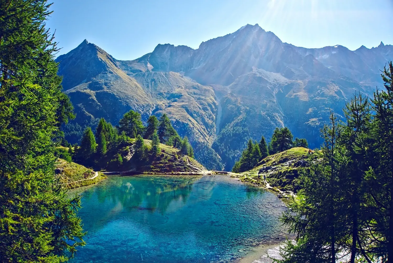 Once we've sorted out the tax details for the lump sum payment of my pension plan, we'll be off hiking again! (at the Blue Lake in Arosa) (Quelle: valais.ch/en)
